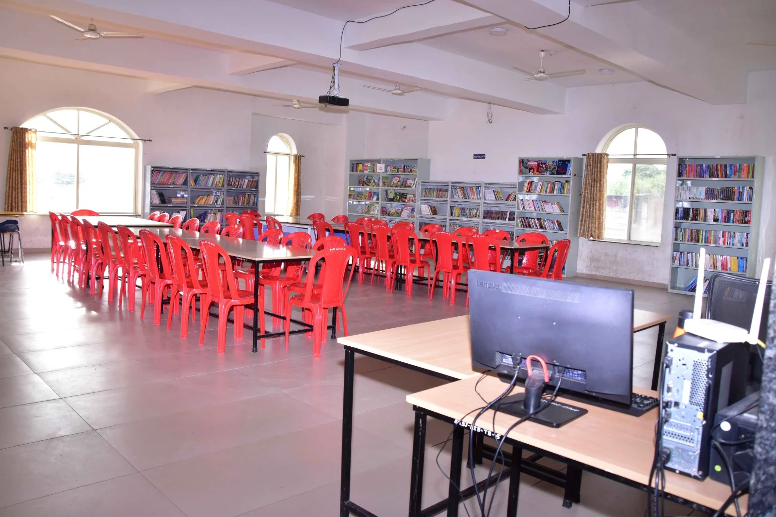 Spacious school library with books, reference materials and reading desks