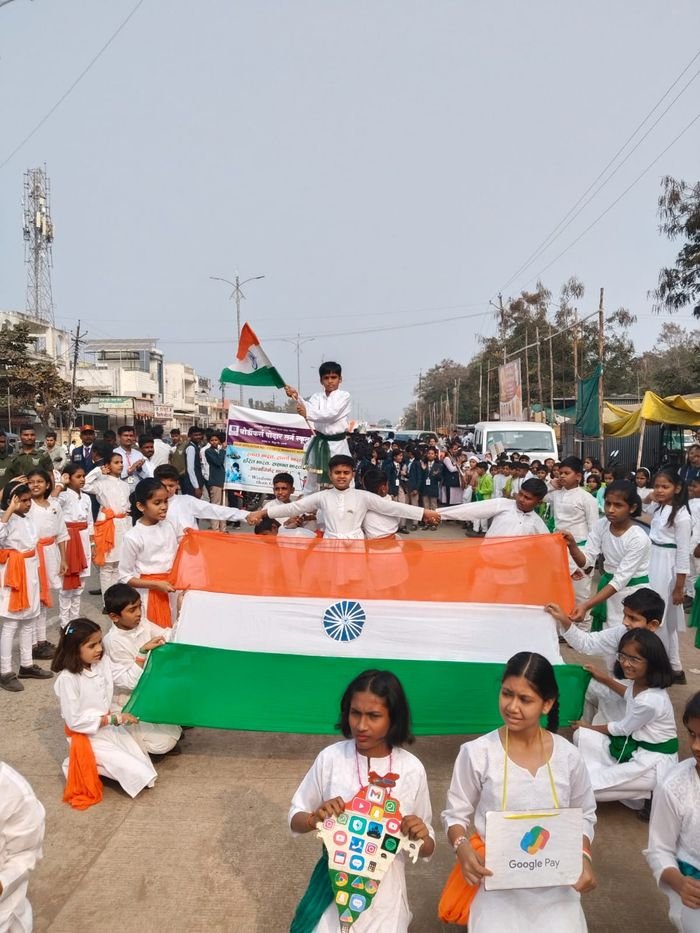 Students carrying the national flag in a rally