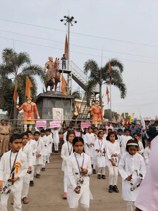Students in white marching in a rally